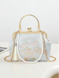 pochette elegante artigianale con motivi di fiori di ciliegio