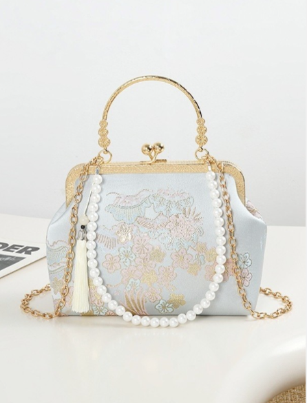Elegante, handgefertigte Clutch mit Kirschblütenmuster