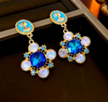 Vintage-Ohrringe mit Beauty-Head aus Zirkonia und Saphirblau (Silbernadel)