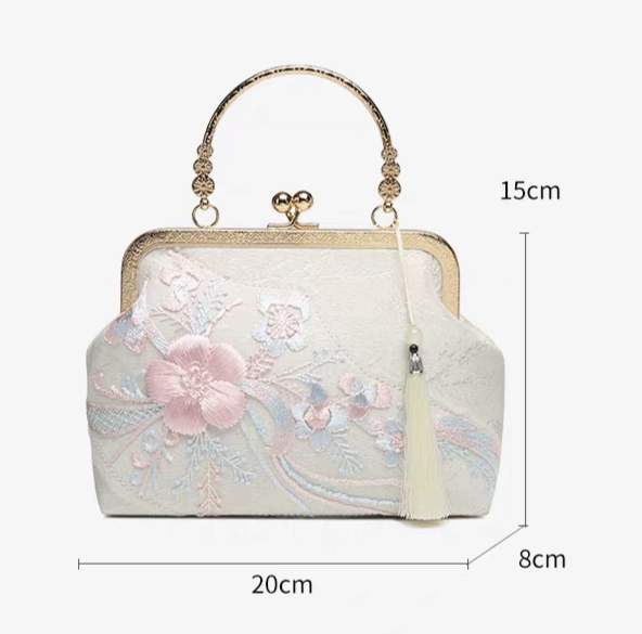 Pochette da sera ricamata stile orientale con perline e nappe