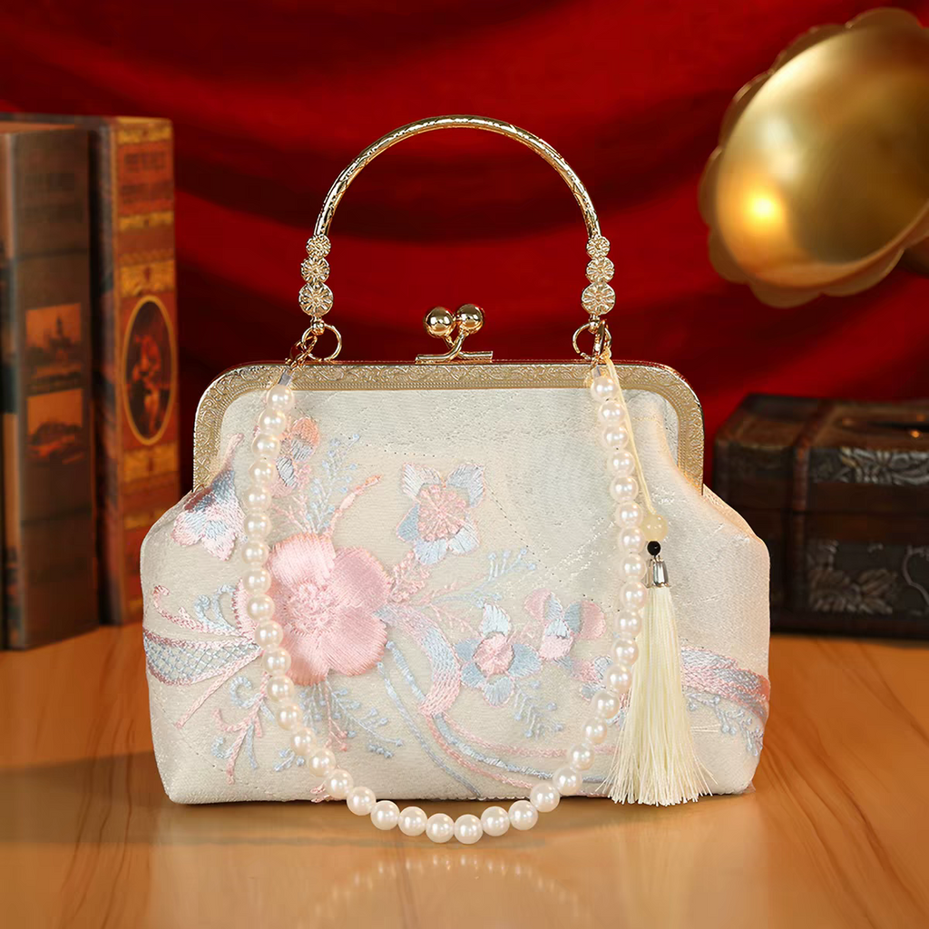 Pochette da sera ricamata stile orientale con perline e nappe