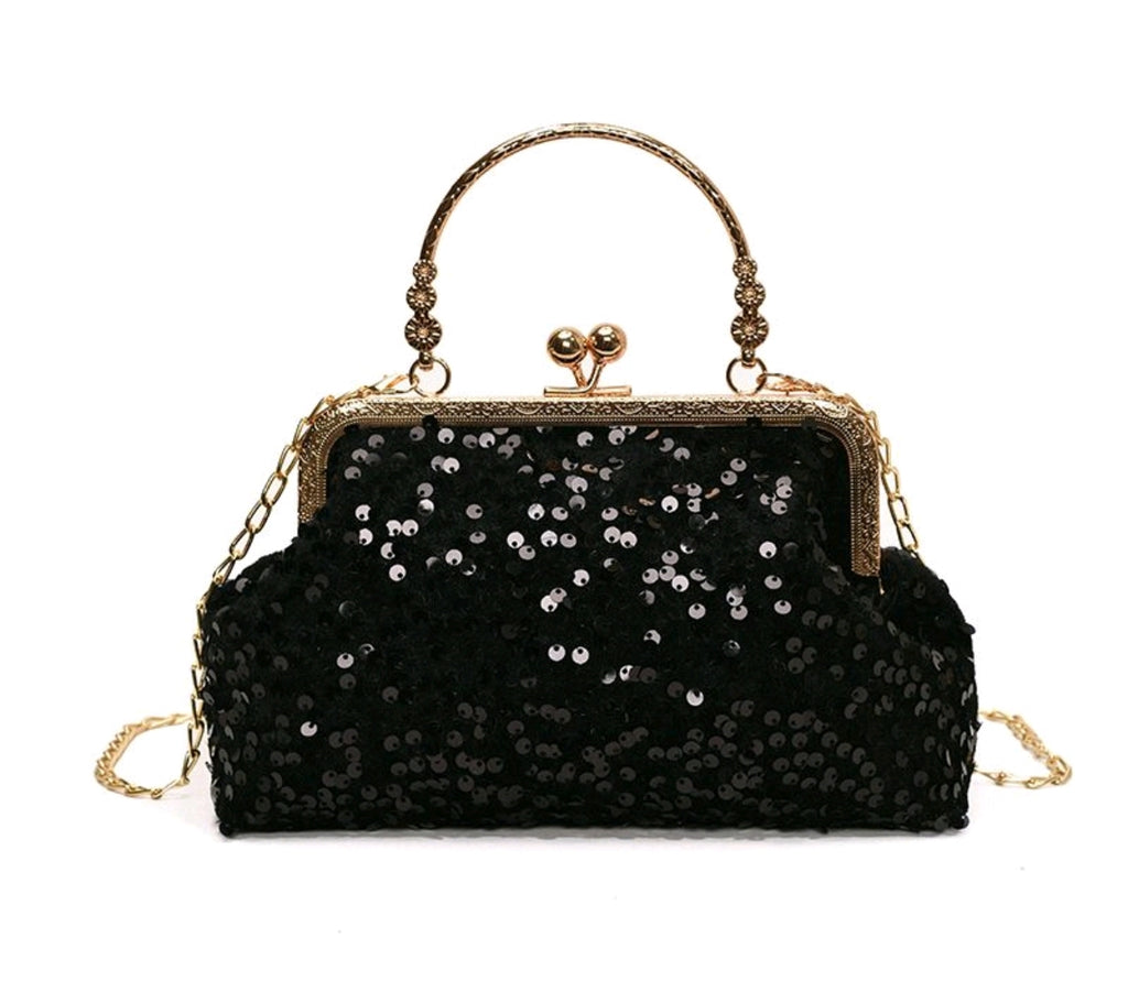 Pochette da sera ricoperta di paillettes brillanti con manico dorato