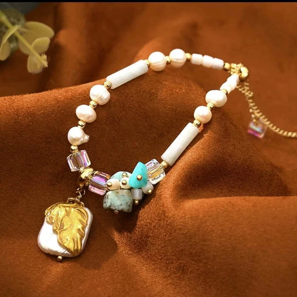 Bracelet with natural pearls, real stones, shells and natural baroque pearl