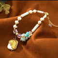 Bracelet with natural pearls, real stones, shells and natural baroque pearl