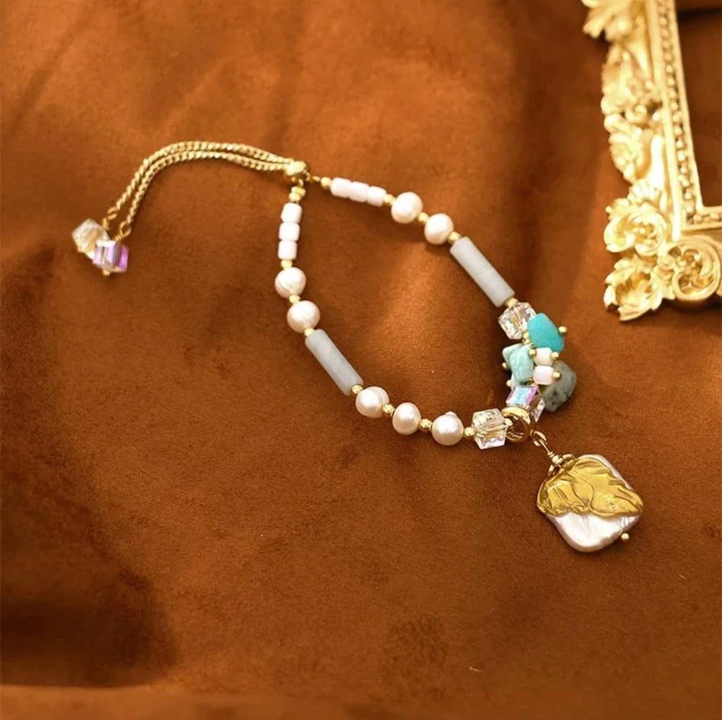 Bracelet with natural pearls, real stones, shells and natural baroque pearl