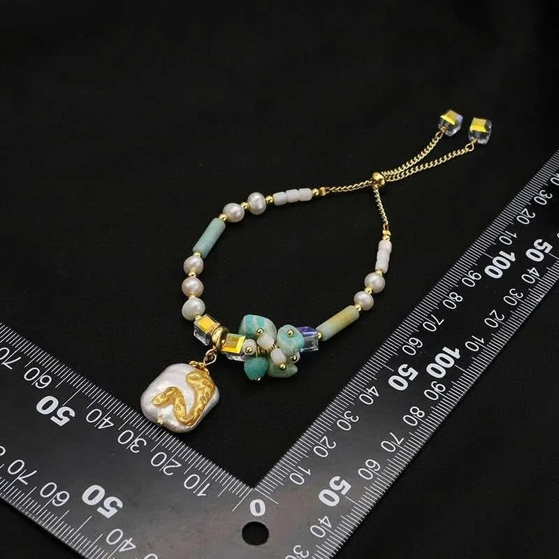 Bracelet with natural pearls, real stones, shells and natural baroque pearl