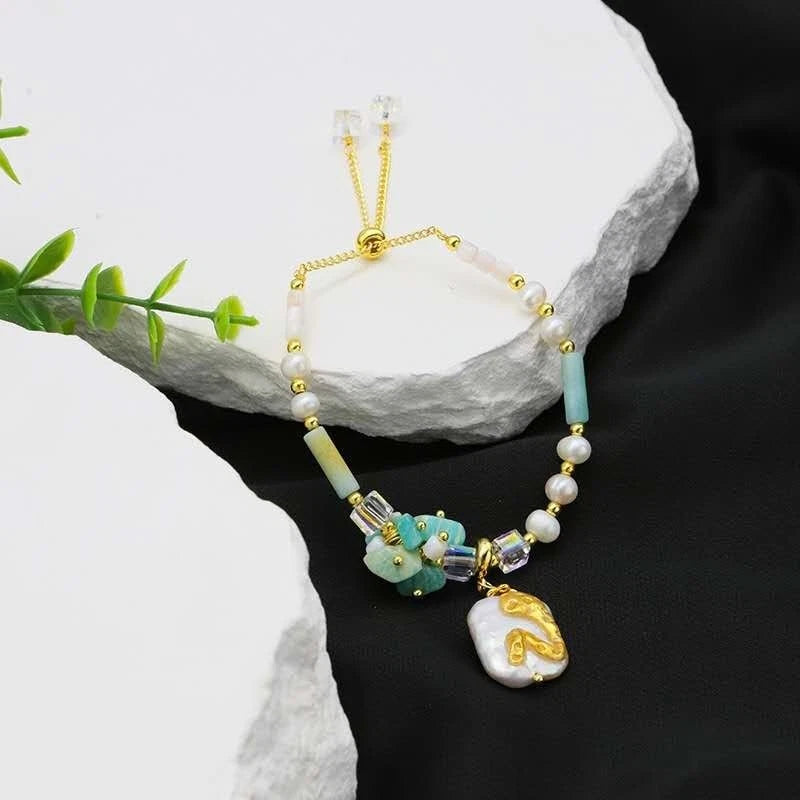 Armband mit Naturperlen, echten Steinen, Muscheln und einer natürlichen Barockperle