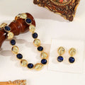 Set 2 Pez. Halskette und Ohrringe mit dunkelblauen Kristallen, vergoldet, hypoallergen