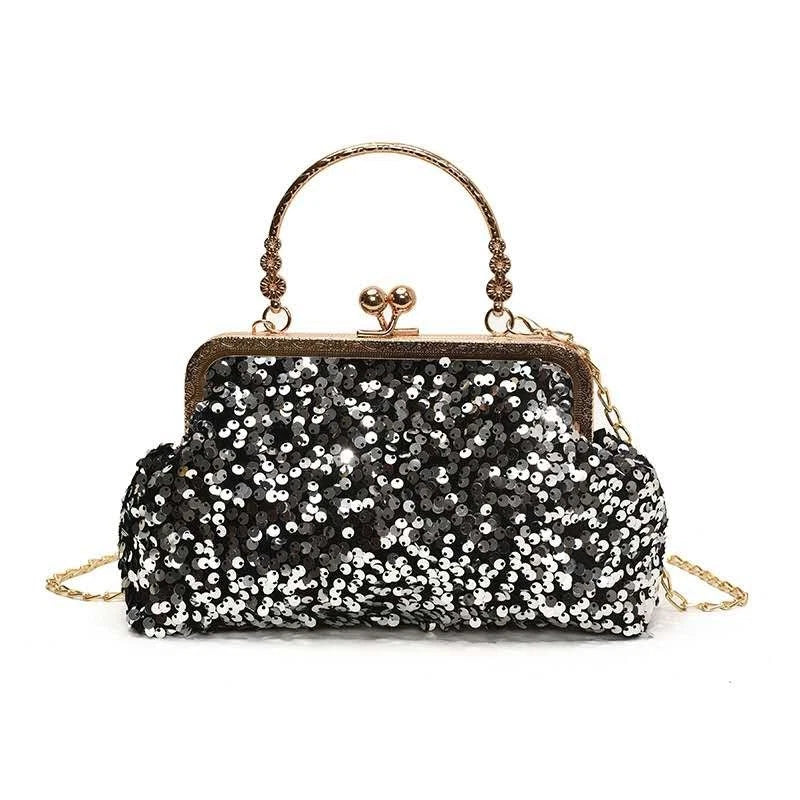 Pochette da sera ricoperta di paillettes brillanti con manico dorato