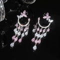 Orecchini trendy con zirconi e nappe con motivi forma farfalla (ago d'argento)