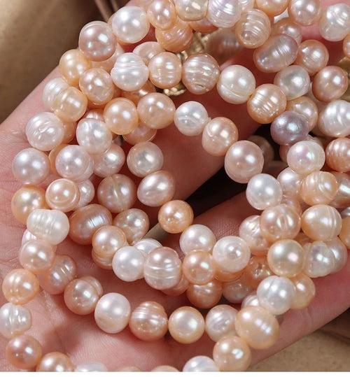 Bracciale elastico con perle d'acqua dolce naturali 9mm"Pesca Lattea"