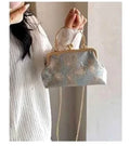 Pochette da sera con ricamo floreale, a mano o a tracolla