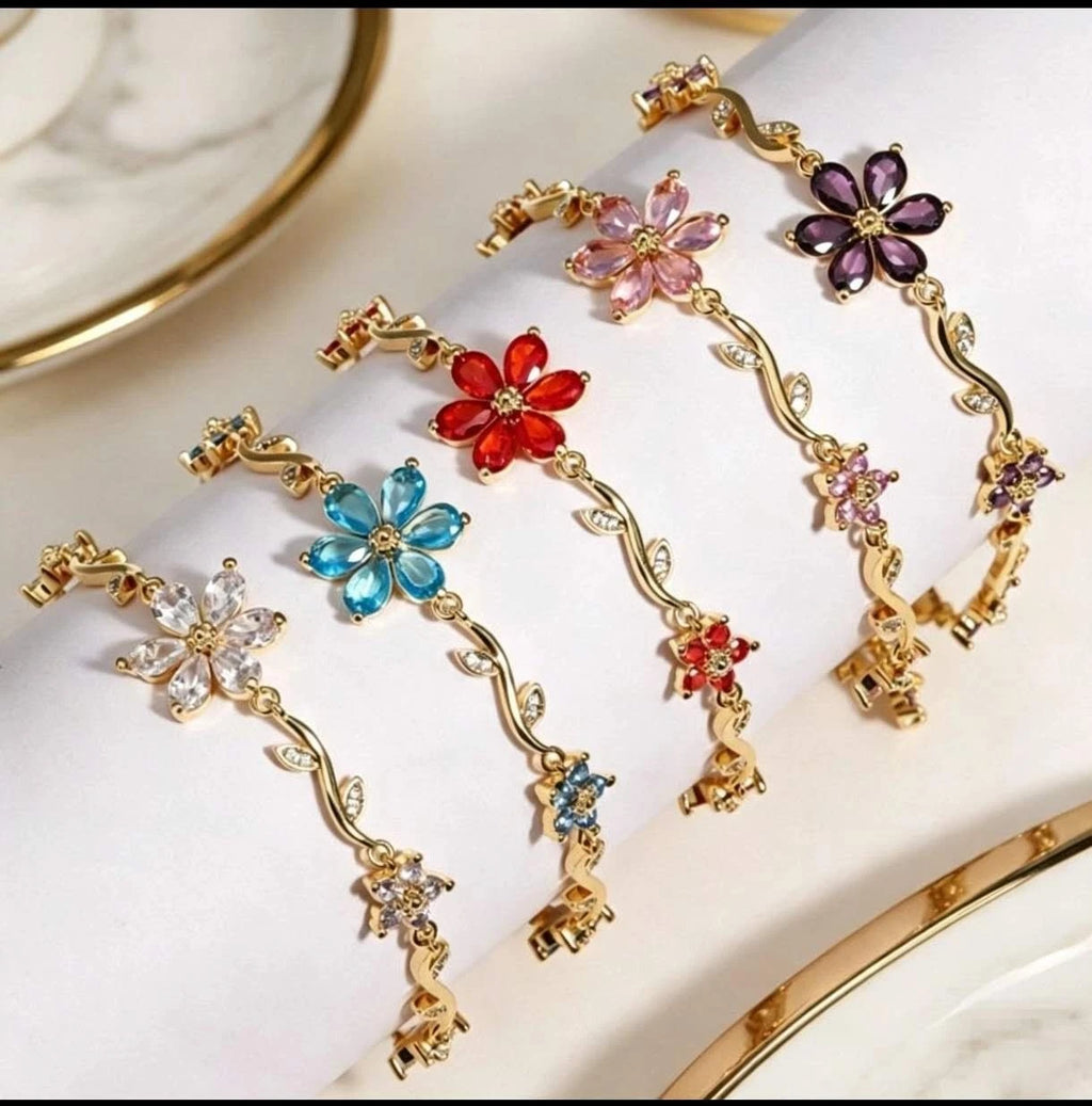 Bracciale con fiori e zirconi color oro con tralci floreali e cristalli