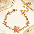 Bracciale con fiori e zirconi color oro con tralci floreali e cristalli