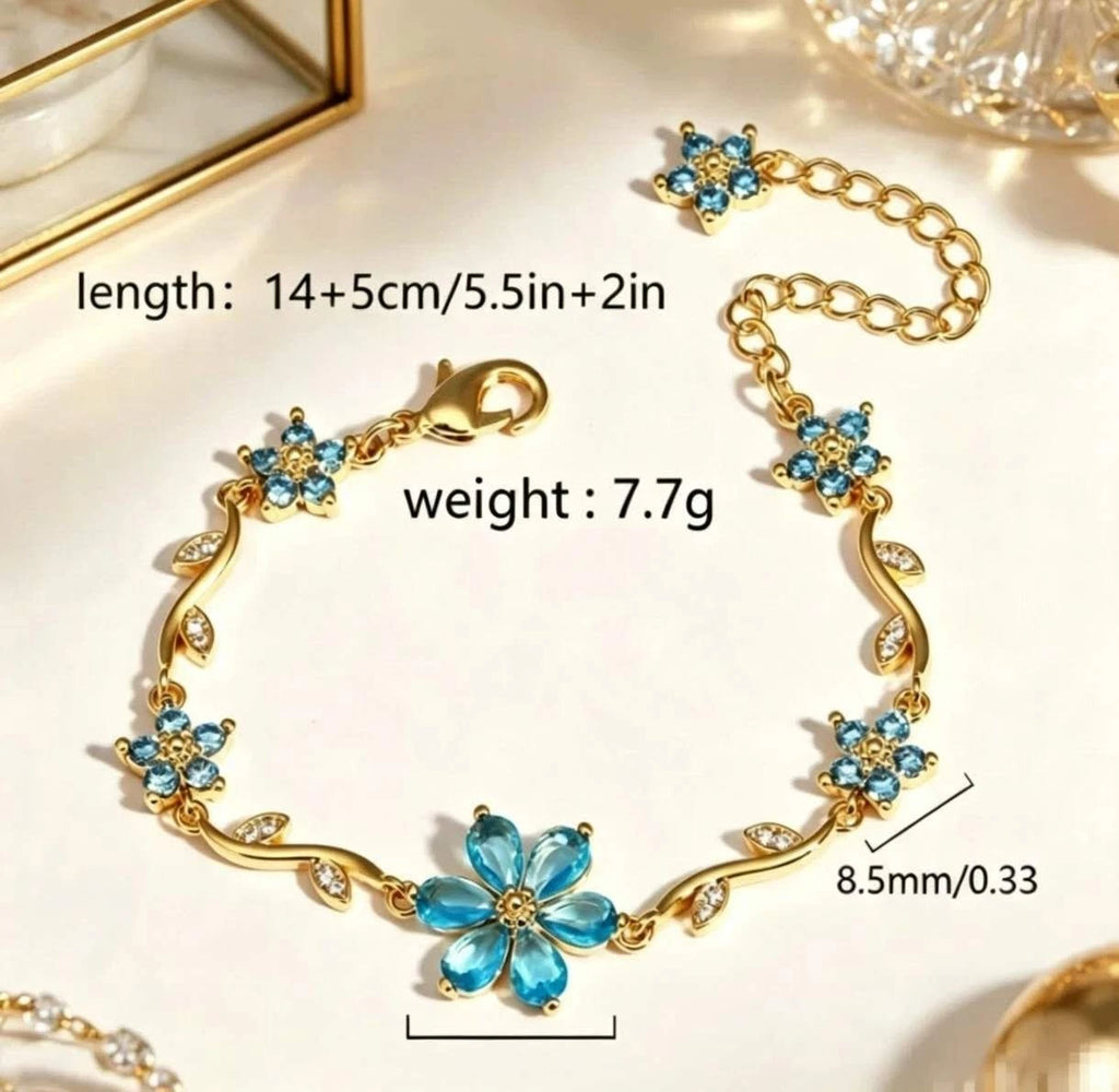 Bracciale con fiori e zirconi color oro con tralci floreali e cristalli