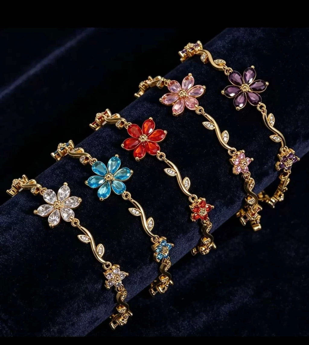 Bracciale con fiori e zirconi color oro con tralci floreali e cristalli