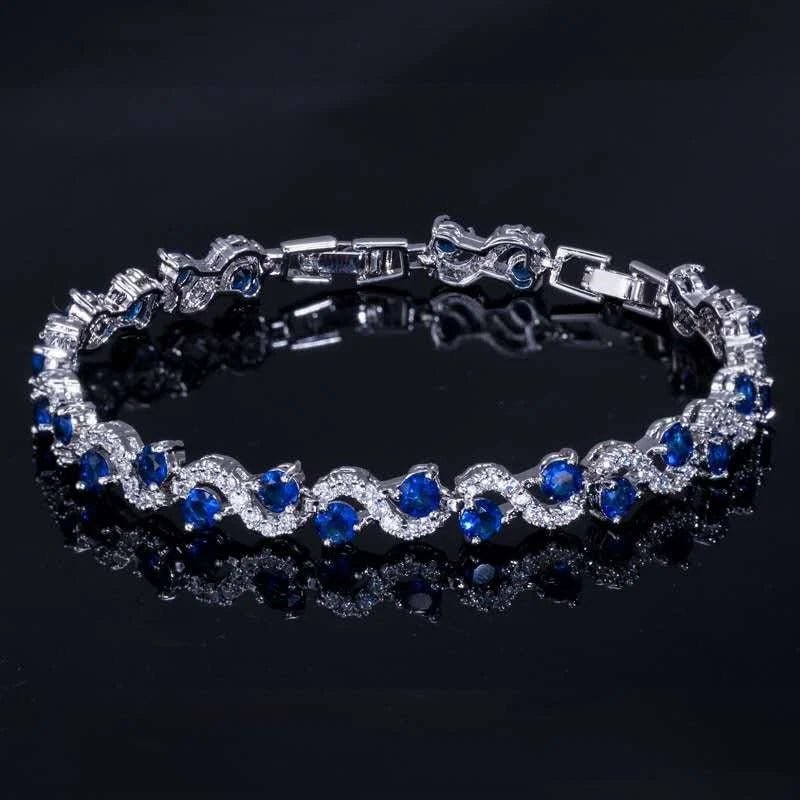 Modisches Armband mit Wellen aus farbigen AAA-Zirkonia und 18k Weißgoldbeschichtung