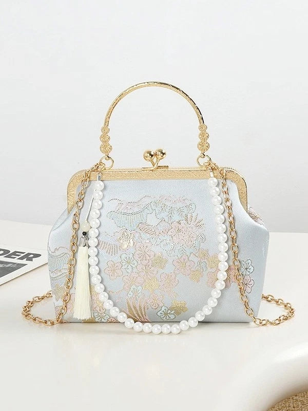 pochette elegante artigianale con motivi di fiori di ciliegio