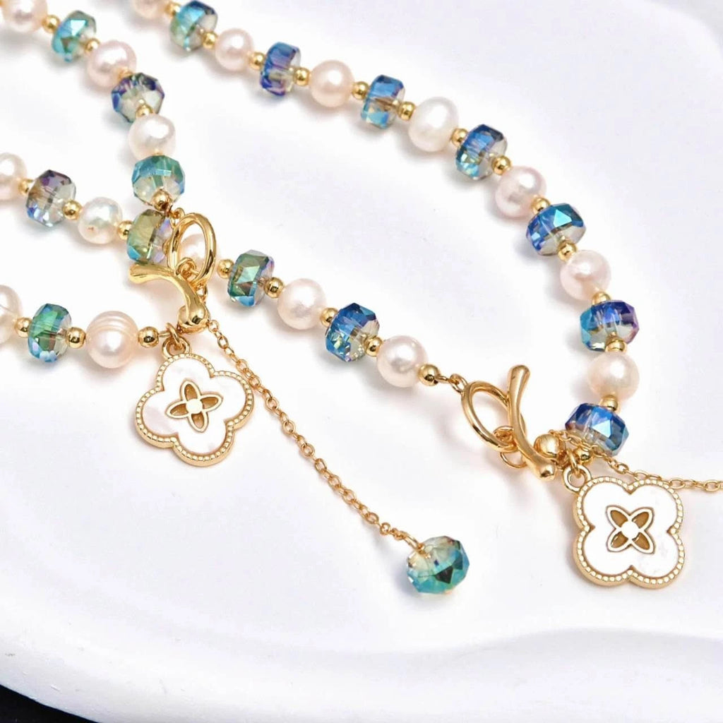 Set collana+bracciale con perle naturali e cristallo cangiante blu, trifoglio