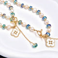 Set collana+bracciale con perle naturali e cristallo cangiante blu, trifoglio