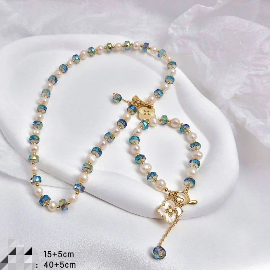 Set collana+bracciale con perle naturali e cristallo cangiante blu, trifoglio