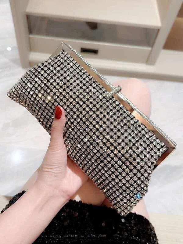 Pochette da sera a mano con strass e cornice metallica