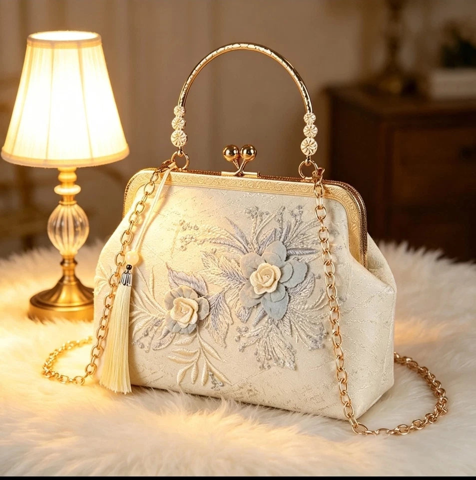 Pochette da sera in seta con ricamo floreale, borsa a mano con perle e nappa