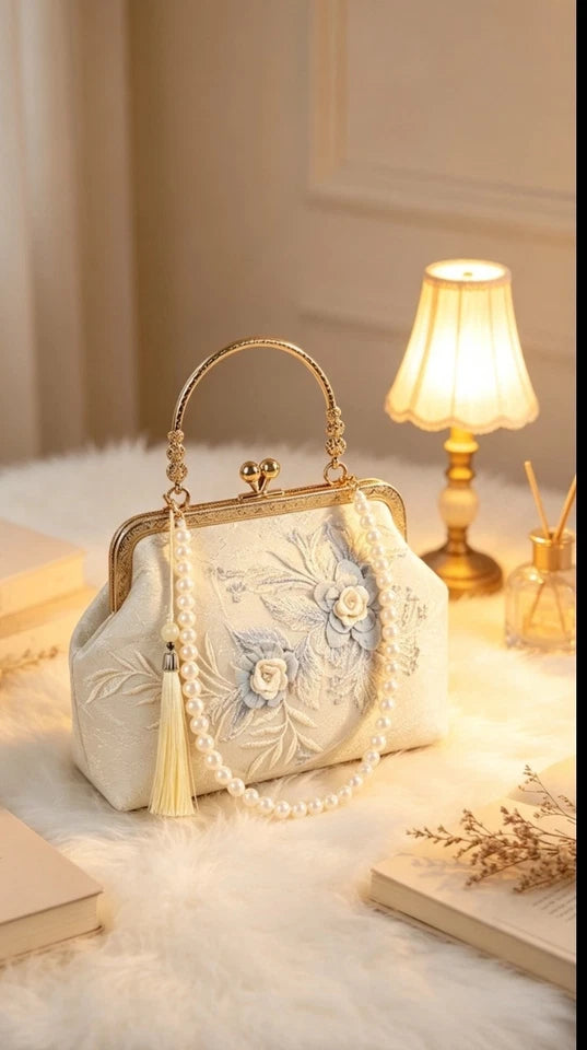 Pochette da sera in seta con ricamo floreale, borsa a mano con perle e nappa